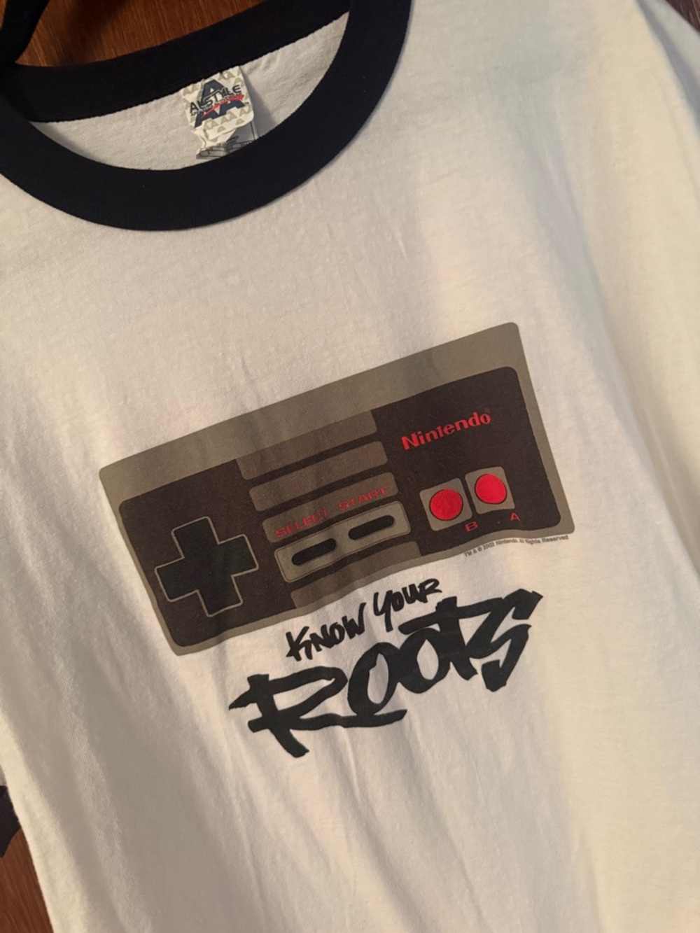 Nintendo White Tee with Black Trim and Red Controller Graphic